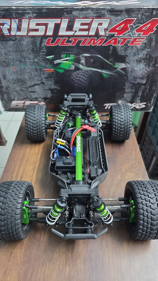 Seller-supplied photo of green Traxxas Rustler Ultimate chassis with original box